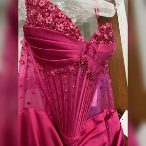 Fuchsia pink tight fitted prom dress or formal with leg slit